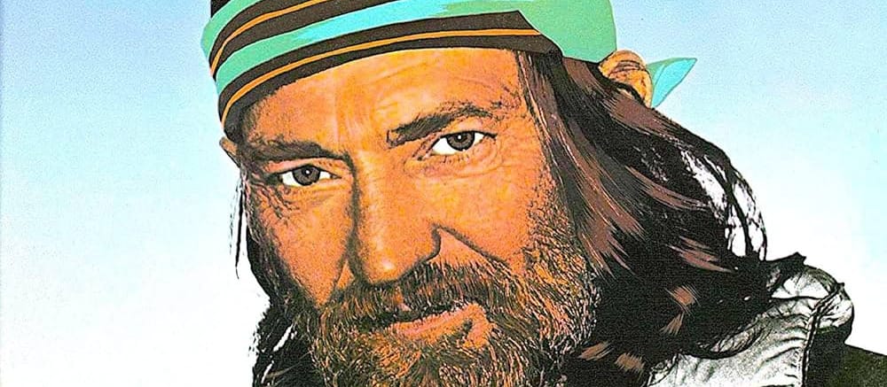 A close up of the cover to Willie Nelson's You Were Always on My Mind album, which features him in ski clothes, including a bright black gold and turquoise headband
